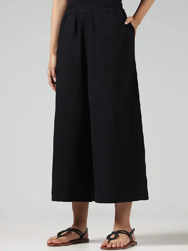 Women's tie - dye festival pants Straight - leg women jeans with a classic and timeless appeal Utsa Solid Black Cotton Blend Ankle Length Palazzos Women's tie - dye festival pants Straight - leg women jeans with a classic and timeless appeal Utsa Solid Black Cotton Blend Ankle Length Palazzos