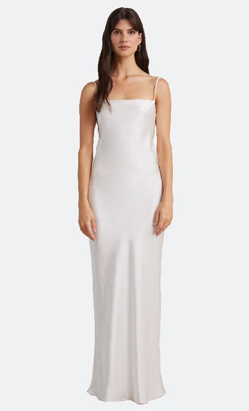 Maxi dresses with a criss - cross back for a flirty and unique detailTHE DREAMER TIE DRESS - IVORY Maxi dresses with a criss - cross back for a flirty and unique detailTHE DREAMER TIE DRESS - IVORY